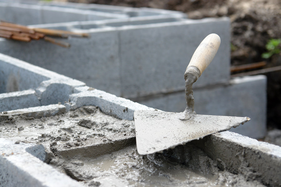wet cement and concrete blocks